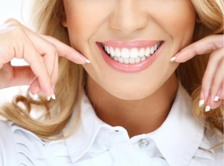 smiling with perfect white teeth