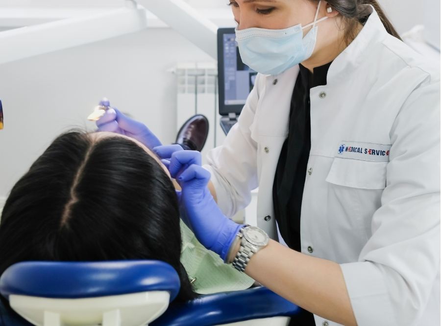 orthodontist checking patient